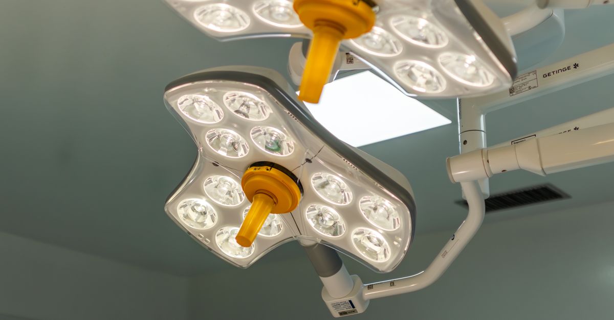 Bright LED surgical lights in a hospital operating room, emphasizing technology and healthcare.